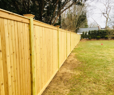 6’ tongue and groove cedar wood fence with cedar boards and 5" pressure treated posts. 