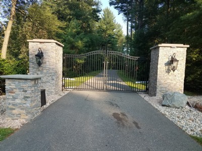 residential gate installation with stone