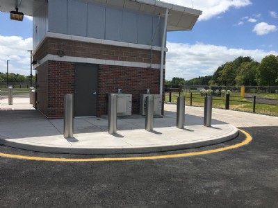 Five security bollards posted side by side