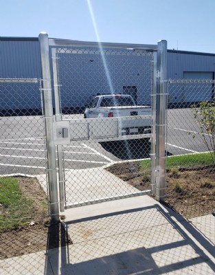 Close-up photo of silver security gate installation