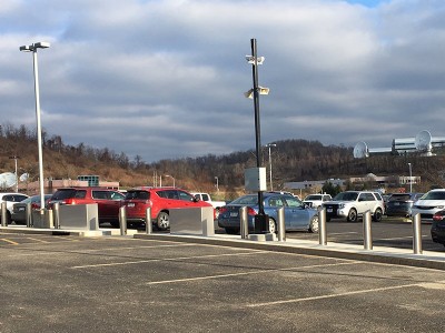 Parking lot with galvanized security bollard posts along the sidewalk